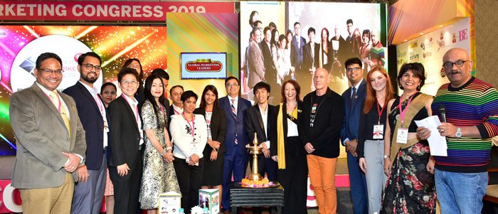 The image is a group photo featuring the 2019 winners of the Most Influential Global Marketing Leaders at the World Marketing Congress 2019.