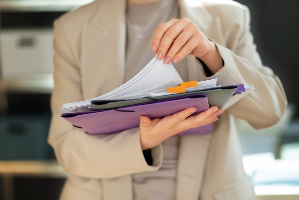 psg-grant-documents woman browsing through documents